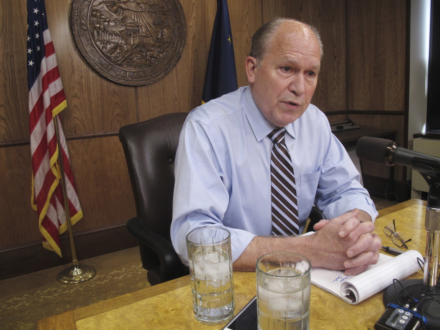 FILE - In this June 8, 2017 file photo, Alaska Gov. Bill Walker meets with reporters in Juneau. Walker is asking the Trump administration to back off when it comes to marijuana.