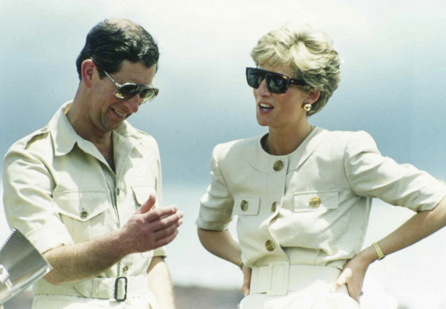 Britain’s Prince Charles and Princess Diana laugh together during their visit to an iron ore mine near Carajas, Brazil, on April 23, 1991. Producers of a new documentary, to be aired Sunday about Princess Diana say it offers insight. Critics say it’s nothing but exploitation.