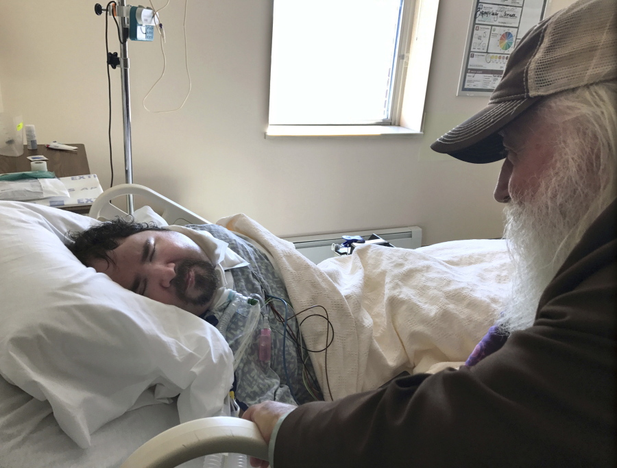 Walter Wenger visits his severely disabled son, Steven, in a hospital in Kingston, N.Y., where he was moved after maggots were twice found in the area around his breathing tube while living in a state group home. The Associated Press obtained a confidential report on the state investigation that determined the 2016 infestations at the group home in Rome, N.Y., were the result of neglect by caregivers. In most states, details of abuse and neglect investigations in state-regulated institutions for the disabled are almost never made public.