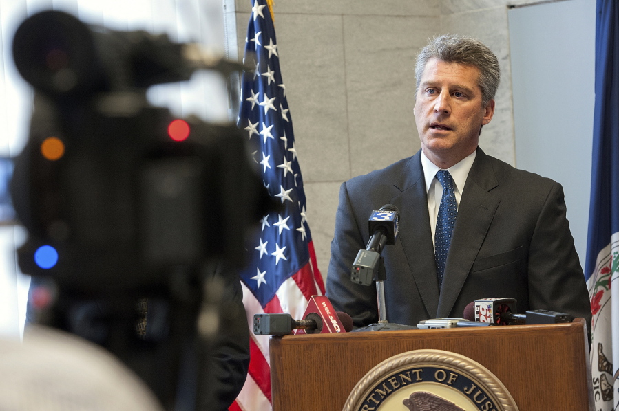 FILE - In this Wednesday, Oct. 15, 2014, file photo, U.S. Attorney Tim Heaphy speaks during a news conference, in Harrisonburg, Va. On Friday, Aug. 25, 2017, the city of Charlottesville, Va., announced that former U.S. Attorney Heaphy will lead an independent review of Charlottesville’s response to three white nationalist rallies this summer, including one earlier in August 2017 that ended with deadly violence.