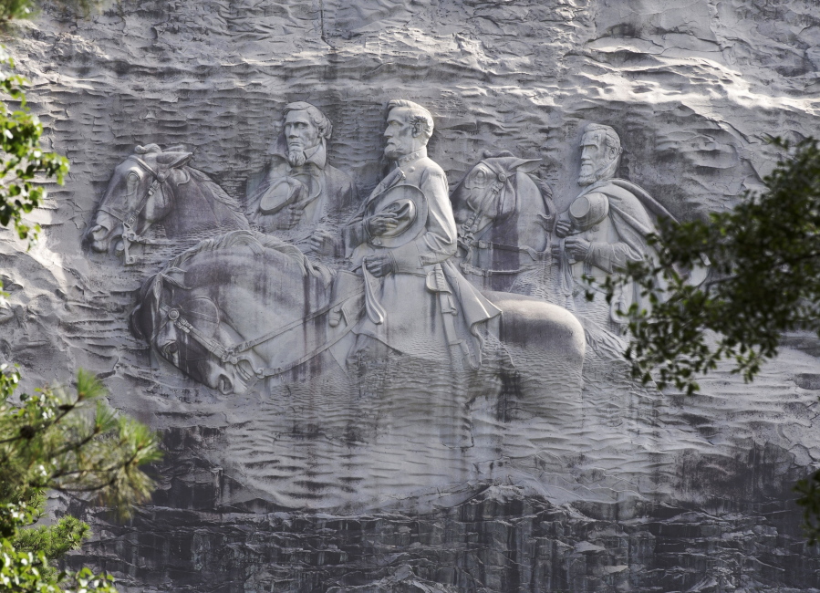 The carving depicting Confederate Civil war figures Stonewall Jackson, Robert E. Lee and Jefferson Davis, in Stone Mountain, Ga. Following the deadly violence surrounding an Aug. 12, 2017, white-nationalist rally in Charlottesville, Va., a Democratic candidate for Georgia governor said the carvings should be removed.