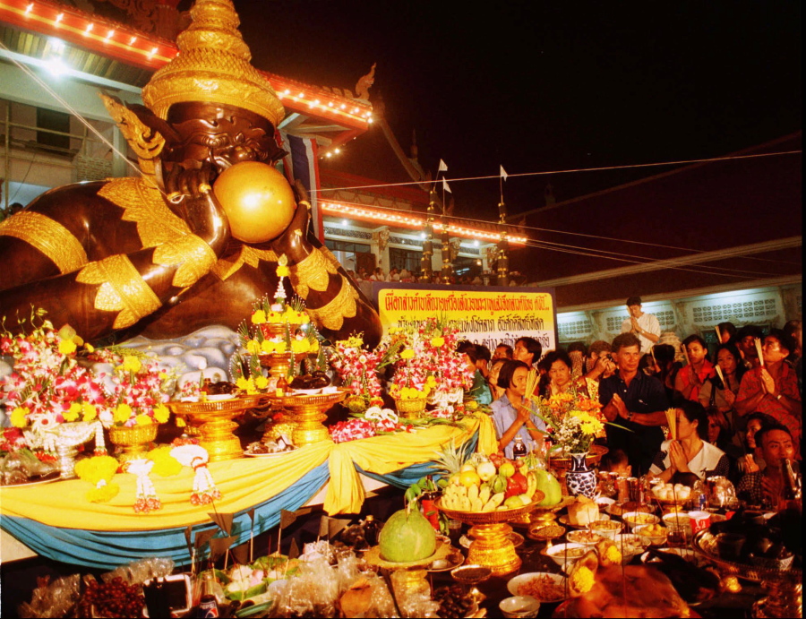 In this Tuesday night, Sept. 16, 1997 file photo, worshippers pay their respects to Rahu (the God of Darkness) during a ceremony at the Srisathong Temple in Nakhon Pathom Province, 50 kilometers (31 miles) west of Bangkok, on the occasion of a lunar eclipse. Describing the Indian myth, Mark Littmann of the University of Tennessee says the demon Rahu tried to steal the nectar of immortality from the gods, but the sun and the moon recognized him. Rahu started drinking the nectar when Vishnu threw a discus and it “sliced right through Rahu’s neck,” Littmann said.