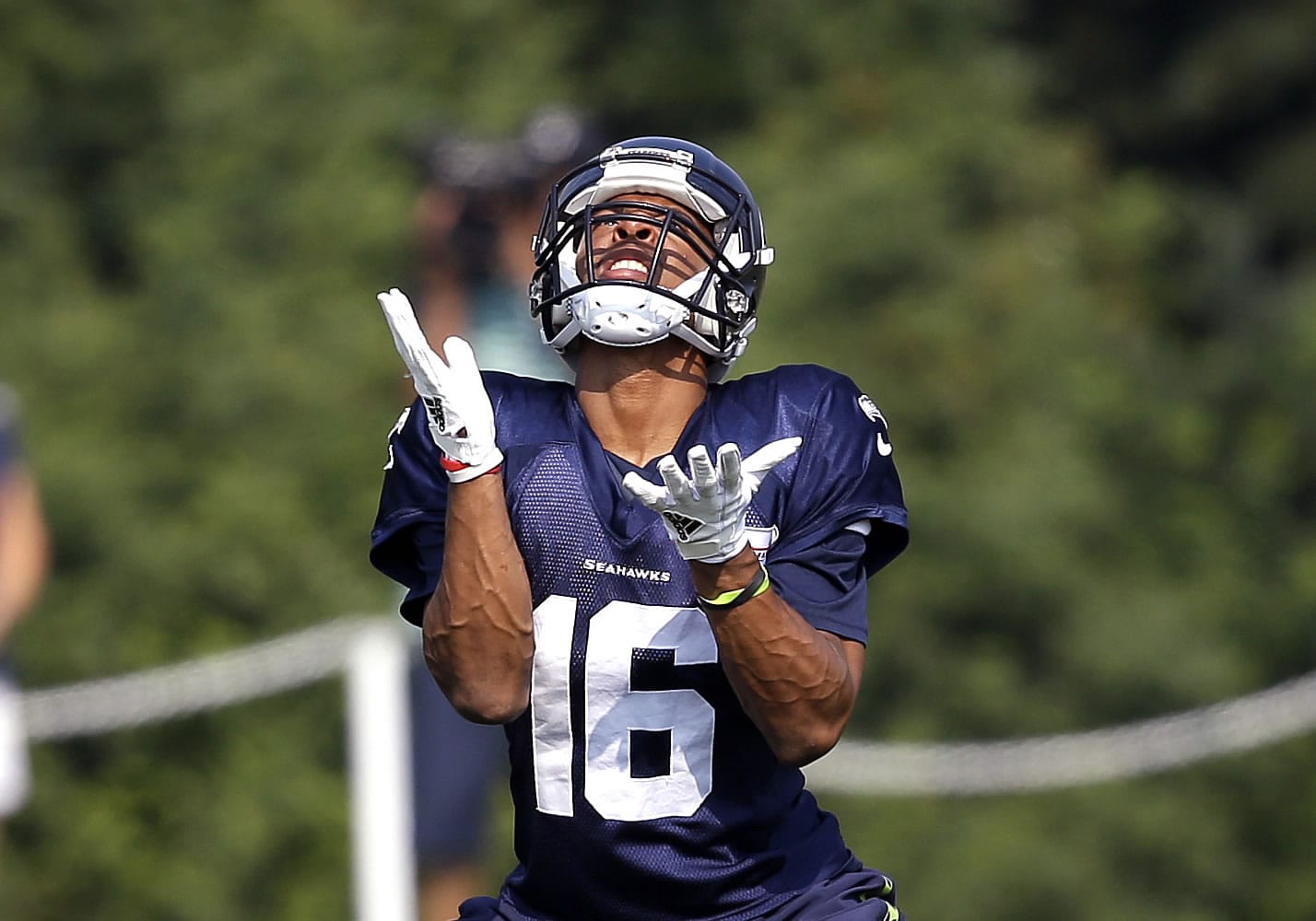 Seattle Seahawks wide receiver Tyler Lockett reaches to catch a ball during NFL football training camp in Friday, Aug. 4, 2017, in Renton, Wash.