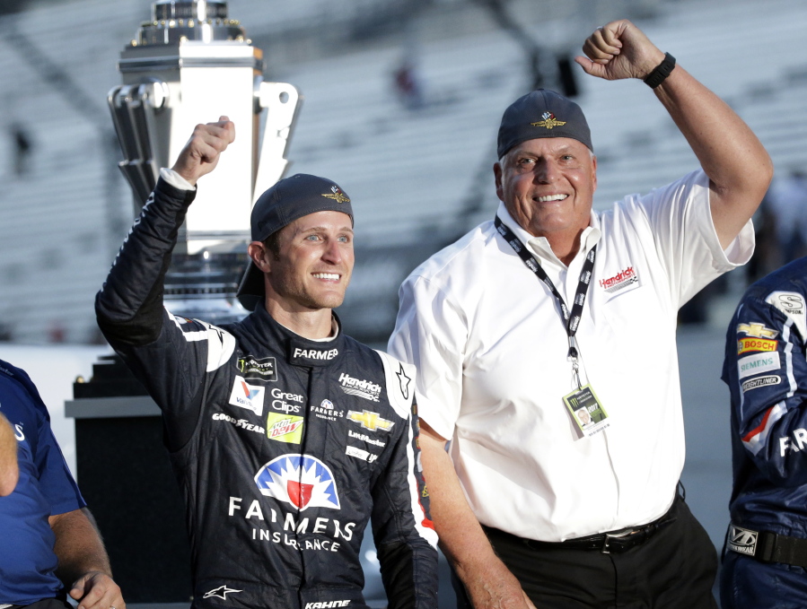 Kasey Kahne, left, celebrates with car owner Rick Hendrick after winning the NASCAR Brickyard 400 last month. Kahne has been released from the final year of his contract, allowing him to begin pursing a Monster Energy Cup ride for 2018.
