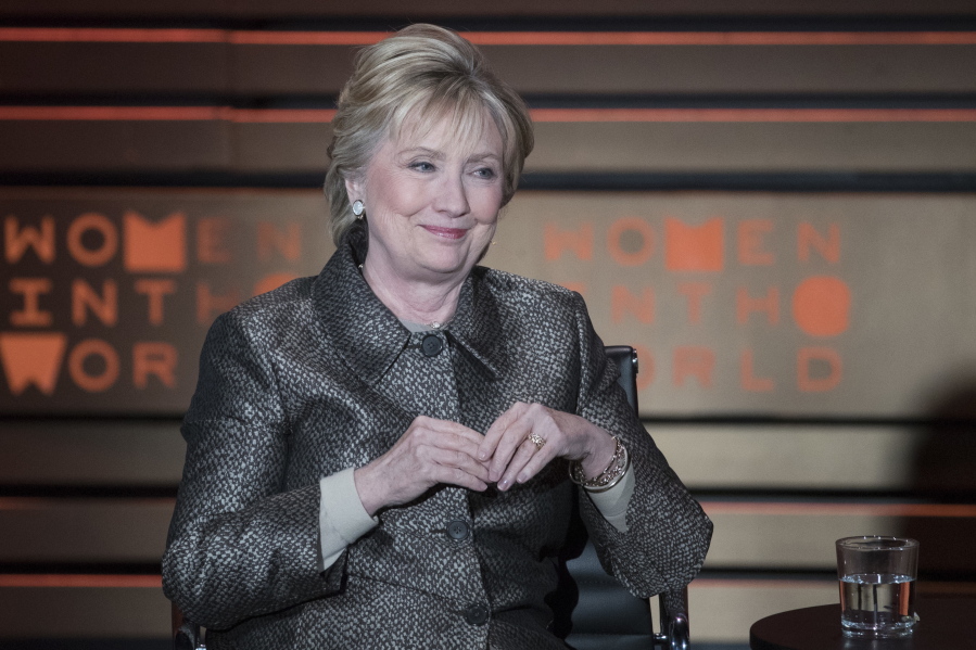 Former U.S. Secretary of State Hillary Clinton speaks during the Women in the World Summit at Lincoln Center in New York. The AP reported on Aug. 4, 2017, that a headline casting doubt on millions of votes for Clinton falsely describes the gist of a National Public Radio story published four years before the 2016 presidential election. Clinton was defeated by Donald Trump in the 2016 presidential election but won the popular vote by nearly 2.9 million votes, according to a count by the AP.