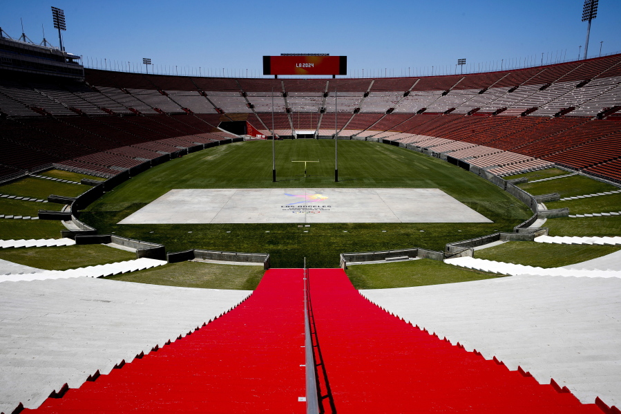 Los Angeles Memorial Coliseum, the venue proposed for Olympic opening and closing ceremonies and track and field events. stands in Los Angeles. The Los Angeles City Council is expected Friday, Aug. 11, 2017 to endorse a proposal to host the 2028 Olympics, following an announcement of a deal last month to leave 2024 to Paris. (AP Photo/Jae C.