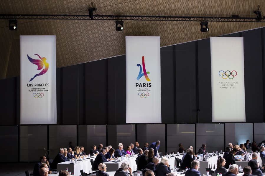 Banners of Los Angeles 2024 candidacy, Paris 2024 candidacy and the International Olympic Committee, during the International Olympic Committee (IOC) Extraordinary Session, at the SwissTech Convention Centre, in Lausanne, Switzerland.