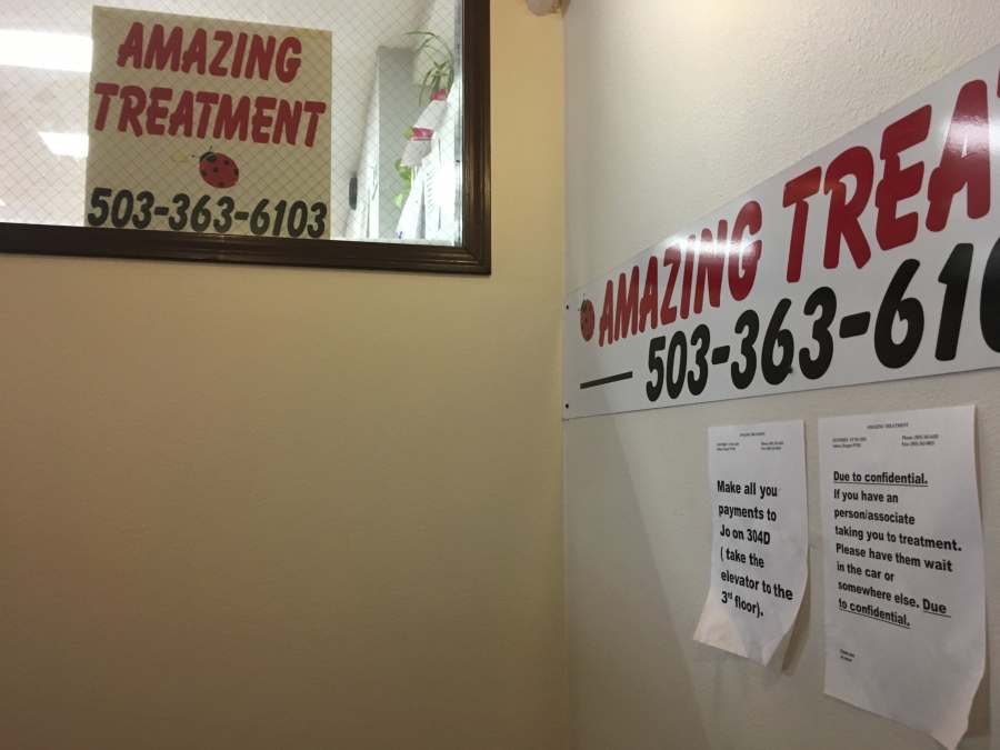 Signs are shown in the Amazing Treatment rehab center in Salem, Ore. A bill signed by Oregon Gov. Kate Brown on Tuesday has reclassified personal-use possession of cocaine, methamphetamine and other drugs as a misdemeanor from a felony.