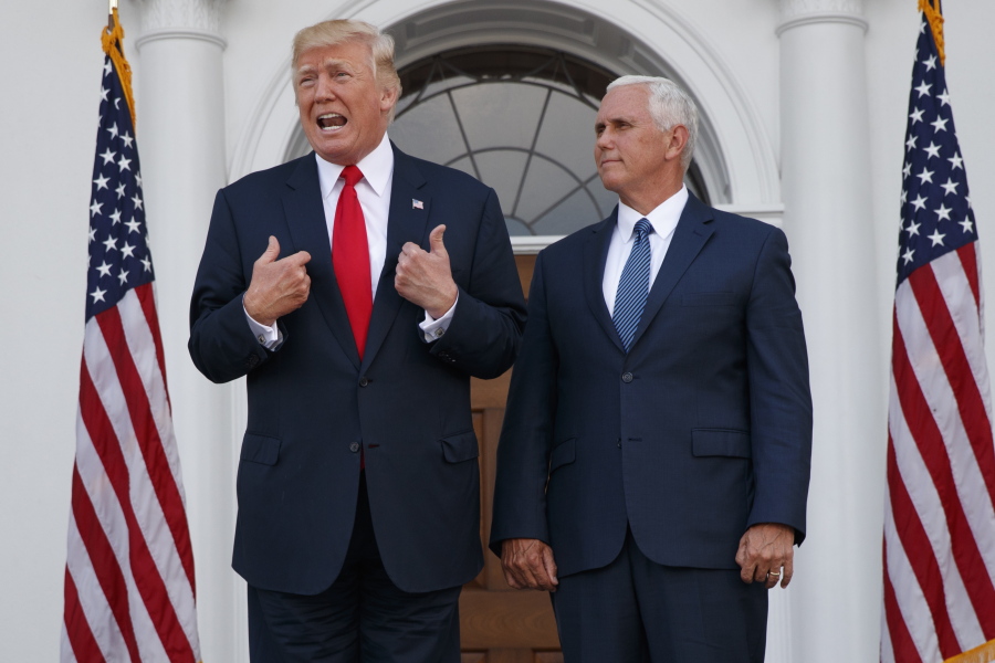 President Donald Trump, accompanied by Vice President Mike Pence, speaks to reporters Aug. 10 before a security briefing at Trump National Golf Club in Bedminster, N.J.
