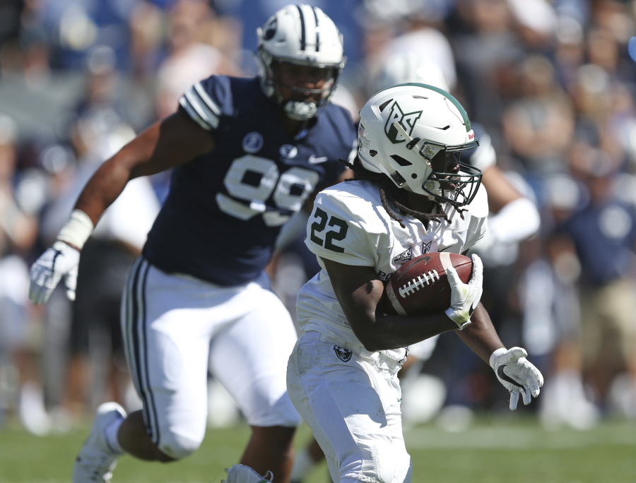 Portland State running back Za’Quan Summers (22) carries the ball as he is pursued by BYU defensive lineman Solomone Wolfgramm (99) in the second half during an NCAA college football game, Saturday, Aug. 26, 2017, in Provo, Utah.