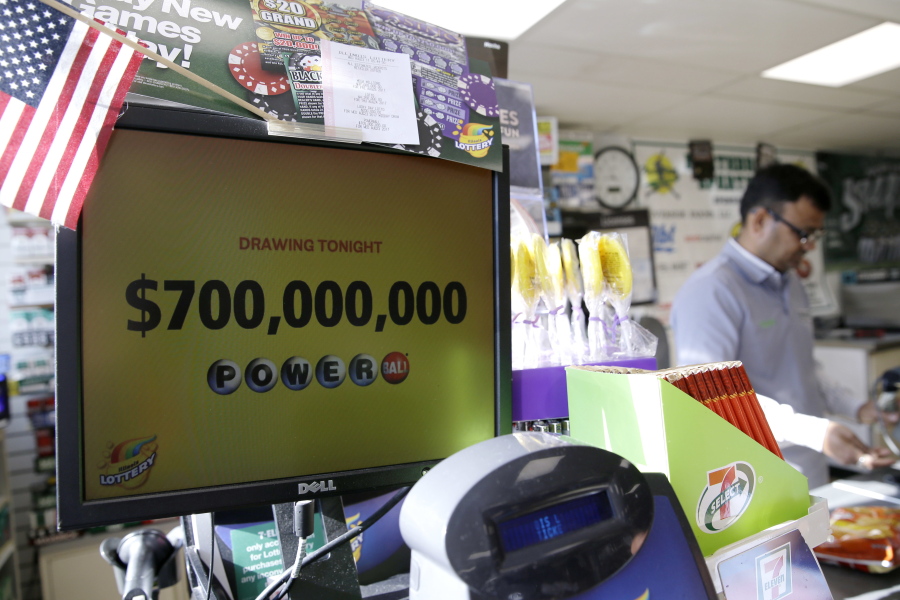 A Powerball lottery sign displays the lottery prizes at a convenience store Wednesday in Northbrook, Ill. Lottery officials said the grand prize for Wednesday night’s drawing has reached $700 million, the second -largest on record for any U.S. lottery game. (AP Photo/Nam Y.