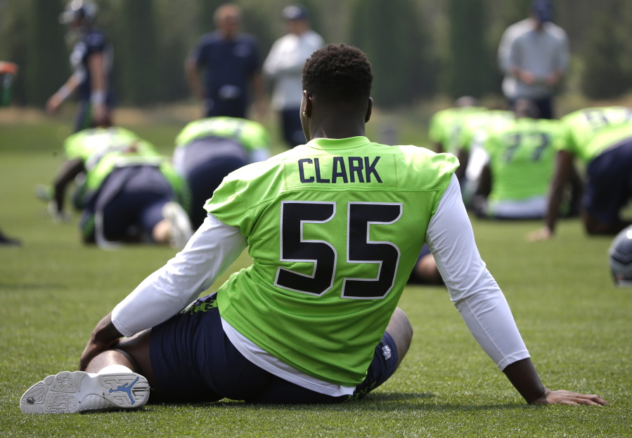 Seattle Seahawks defensive end Frank Clark (55) stretches during warmups before NFL football training camp, Monday, Aug. 7, 2017, in Renton, Wash. (AP Photo/Ted S.