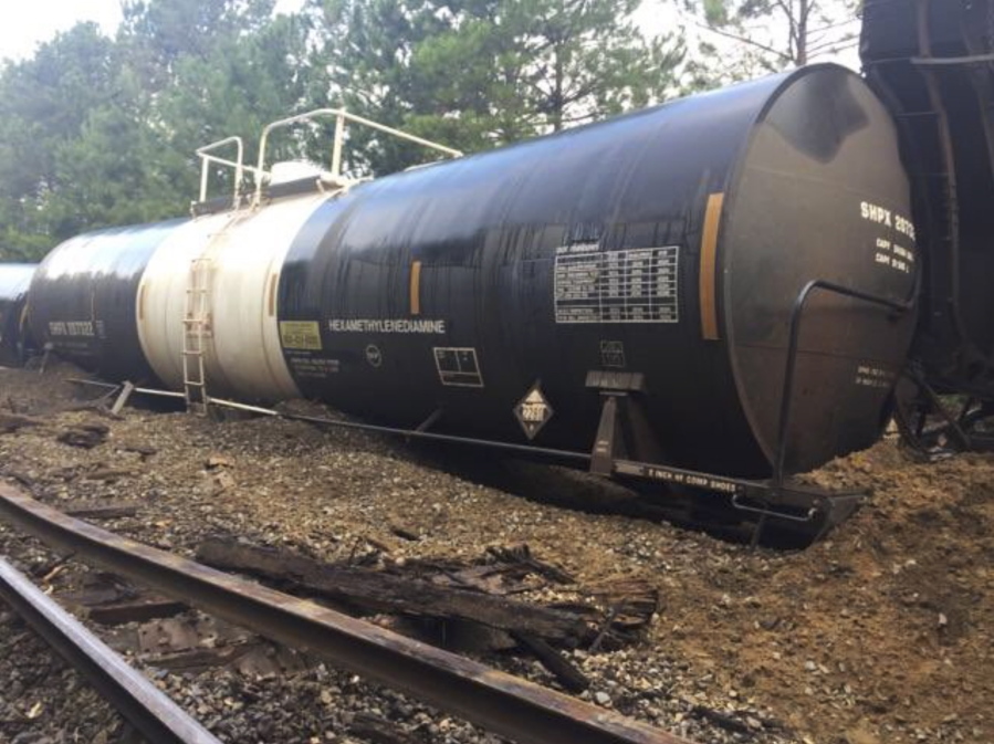 Derailed freight cars sit Sunday near Lugoff northeast of Columbia, S.C. The derailment damaged the track, delaying a nearby passenger train.