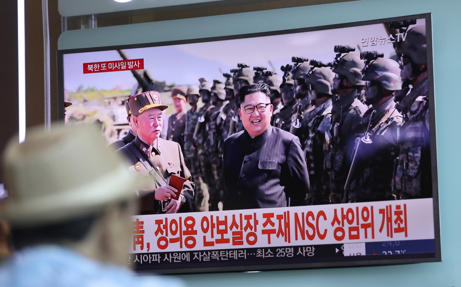 In this Saturday, Aug. 26, 2017, file photo, a man watches a screen showing an image of North Korean leader Kim Jong Un, at the Seoul Train Station in Seoul, South Korea. Three North Korea short-range ballistic missiles failed on Saturday, U.S. military officials said, which, if true, would be a temporary setback to Pyongyang’s rapid nuclear and missile expansion.