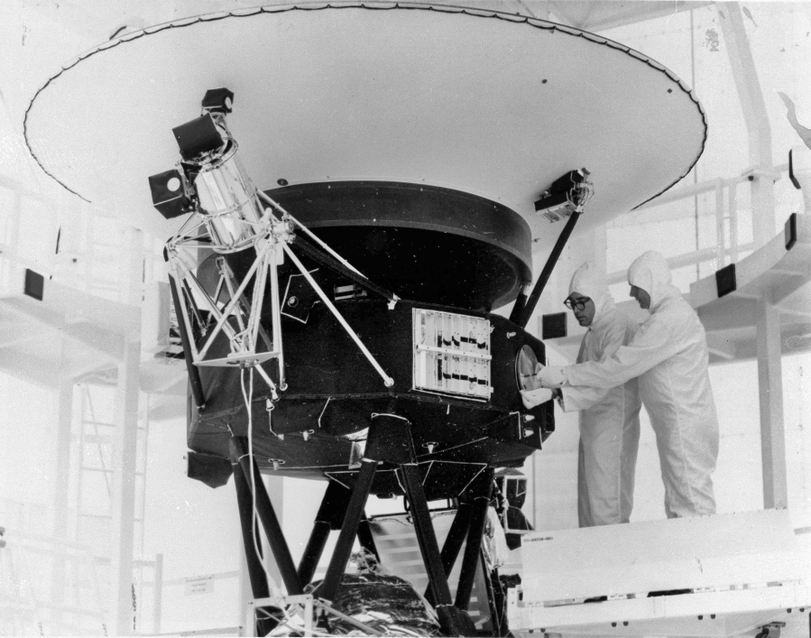 FILE - In this Aug. 4, 1977 photo provided by NASA, the "Sounds of Earth" record is mounted on the Voyager 2 spacecraft in the Safe-1 Building at the Kennedy Space Center, Fla., prior to encapsulation in the protective shroud. Sunday, Aug. 20, 2017 marks the 40th anniversary of NASA's launch of Voyager 2, now almost 11 billion miles distant.