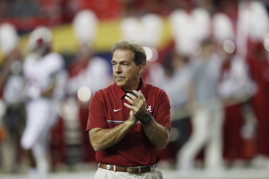 FILE - In this Dec. 3, 2016, file photo, Alabama coach Nick Saban watches his team warm up for the Southeastern Conference championship NCAA college football game between Alabama and Florida in Atlanta. Alabama has the No. 1 spot in The Associated Press' preseason media poll. Saban's Tide has become the surest thing in sports these days. They don't always win the national championship -- just half the time over the last eight years–but they are always in contention. Since 2008, only once has the Tide lost more than one game before bowl season.