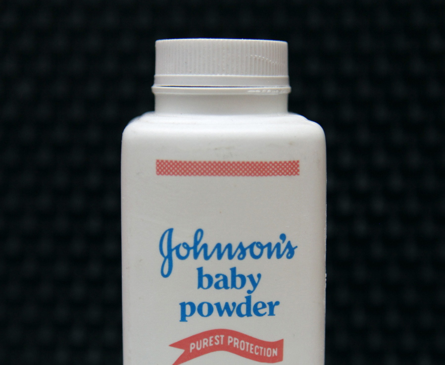 FILE - In this April 15, 2011, file photo, a bottle of Johnson’s baby powder is displayed. On Monday, Aug. 21, 2017, a Los Angeles County Superior Court spokeswoman confirmed that a jury has ordered Johnson & Johnson to pay $417 million in a case to a woman who claimed in a lawsuit that the talc in the company’s iconic baby powder causes ovarian cancer when applied regularly for feminine hygiene.