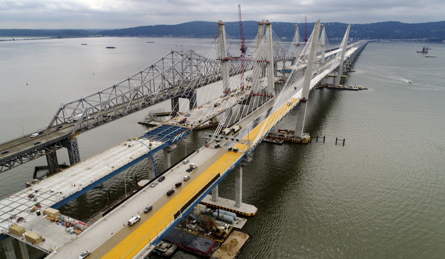 Construction continues on the spans of the new Governor Mario M. Cuomo Bridge, right, as vehicles make their way on the the Tappan Zee Bridge over the Hudson River, near Tarrytown, N.Y. President Donald Trump’s road to getting legislation through Congress this year to restore the nation’s crumbling infrastructure appears increasingly precarious.