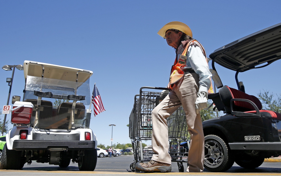 Although he didn’t vote in the last presidential election, David Ash, 64, of Sun City, Ariz., talks about his support of President Donald Trump at a local grocery store Wednesday in Sun City, Ariz. (AP Photo/Ross D.