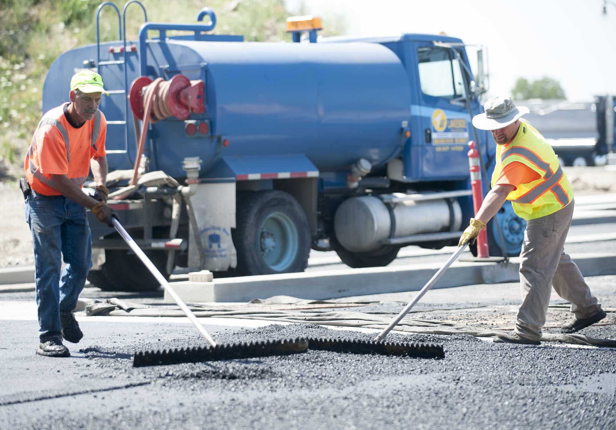 A crew from Rotschy Inc. of Vancouver works on a paving project in 2016.