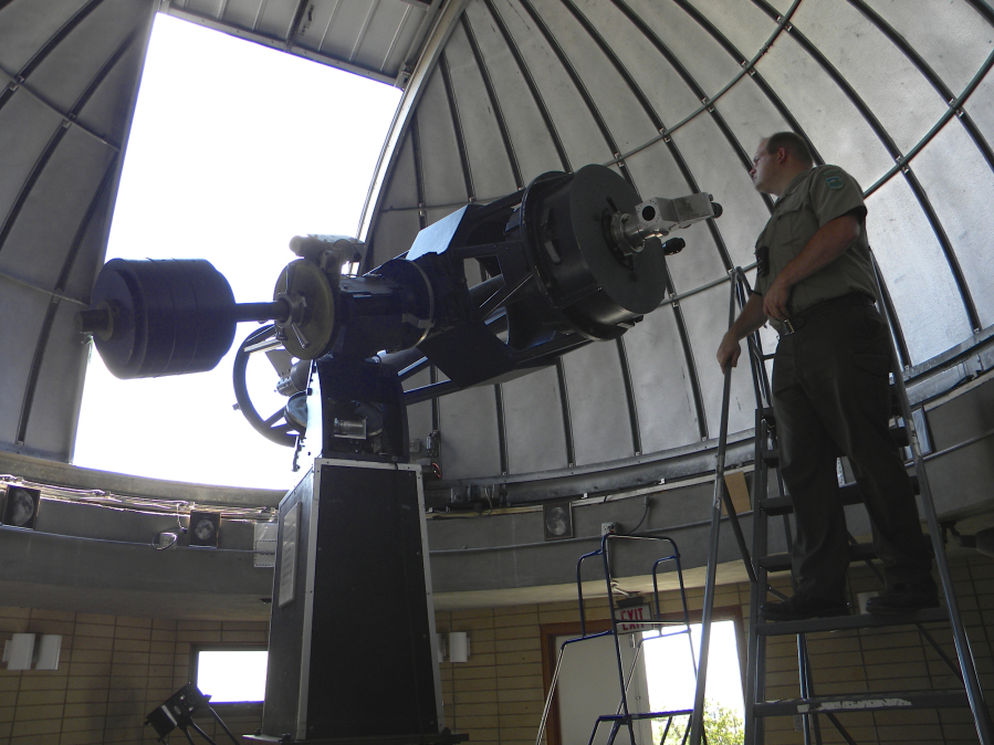 Troy Carpenter, observatory administrator at Goldendale Observatory State Park, with a telescope.