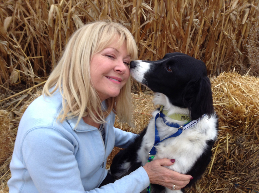 Kim Jasper of Moses Lake shares a moment with Ruckus, the border collie she rescued.
