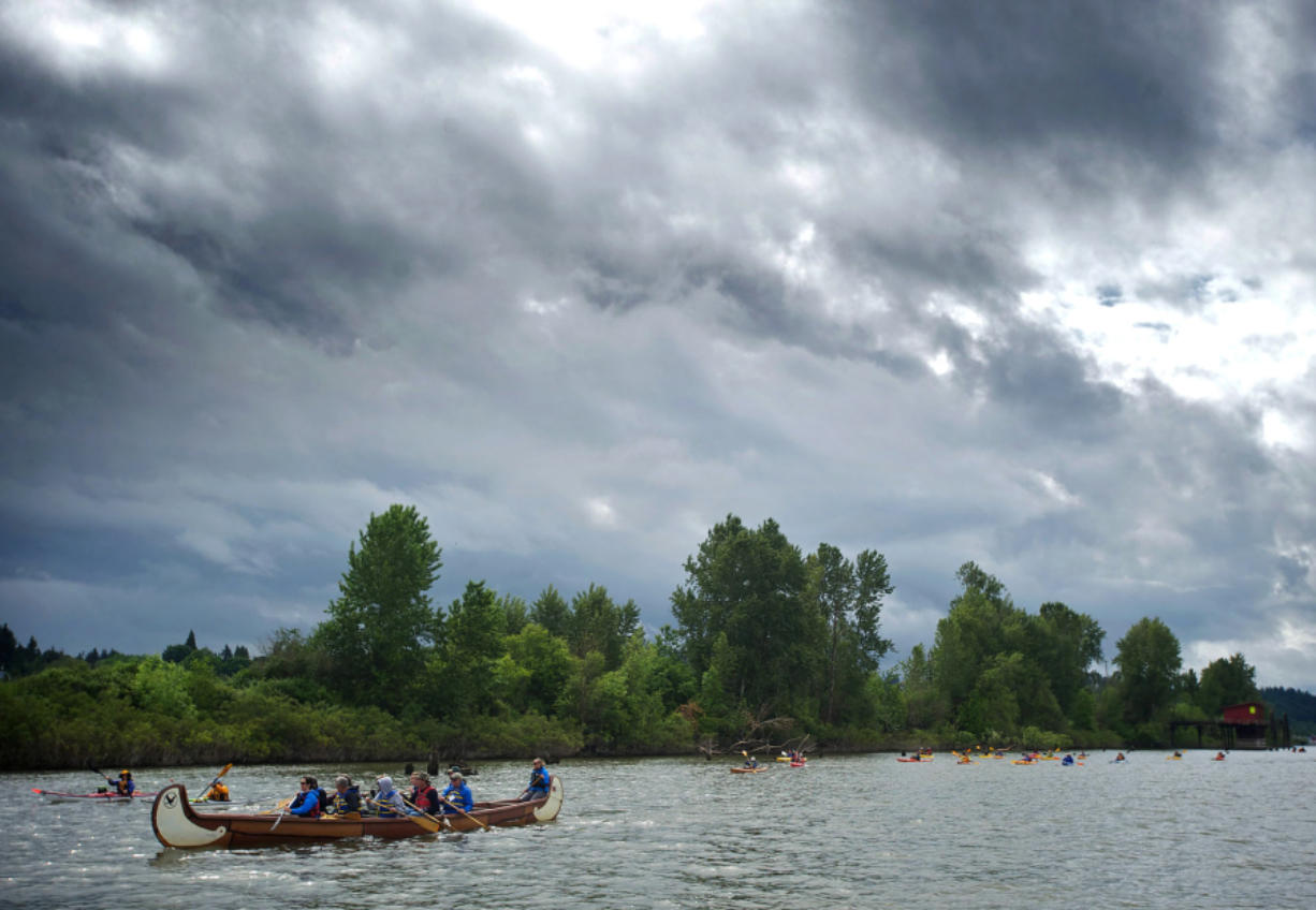 Boaters paddle down the Lake River during the Big Paddle event. A proposed conservation project would established shore-based staging and stopping areas on its beaches.