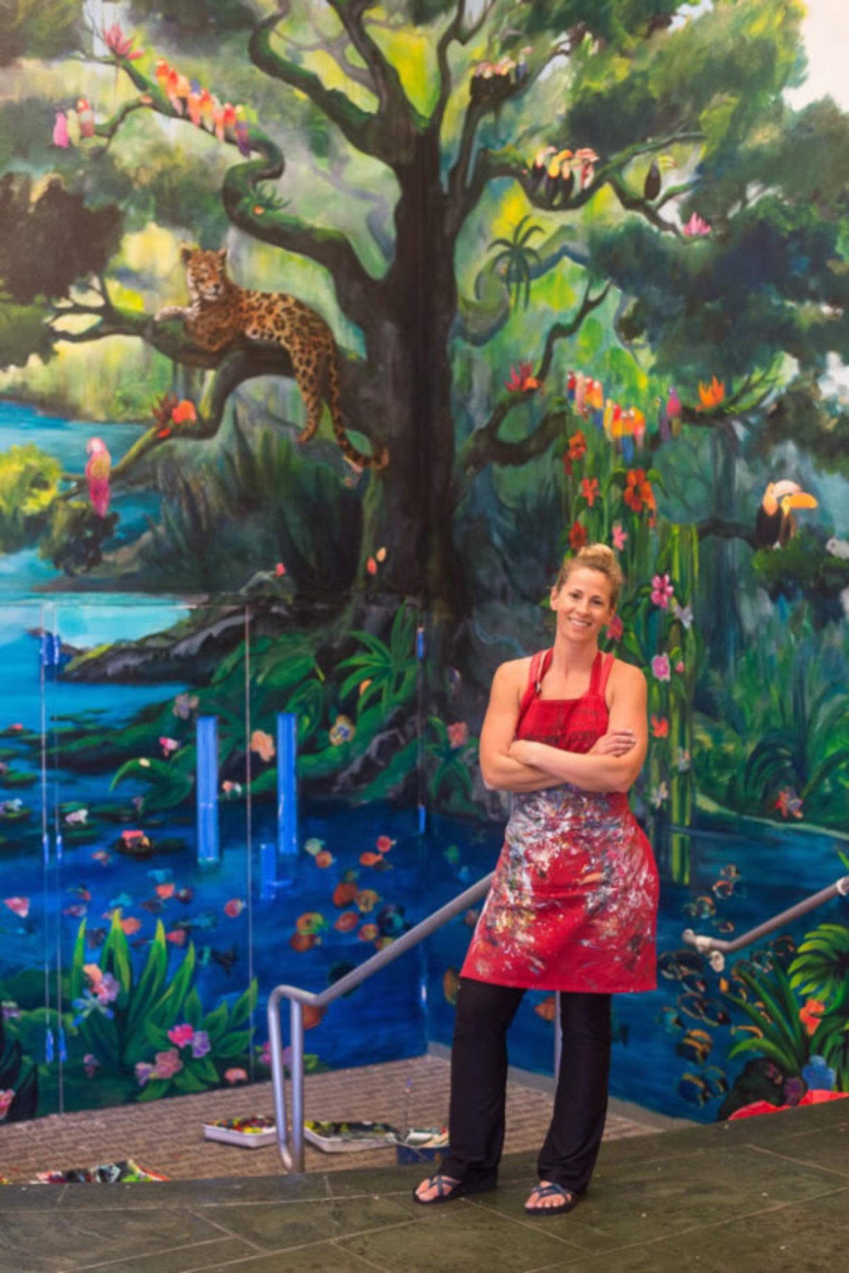 Camas: Local artist Elida Field puts the finishing touches on a jungle-themed mural at Prune Hill Elementary School combining the works of Field, artist Elsa Harris and students at the school.