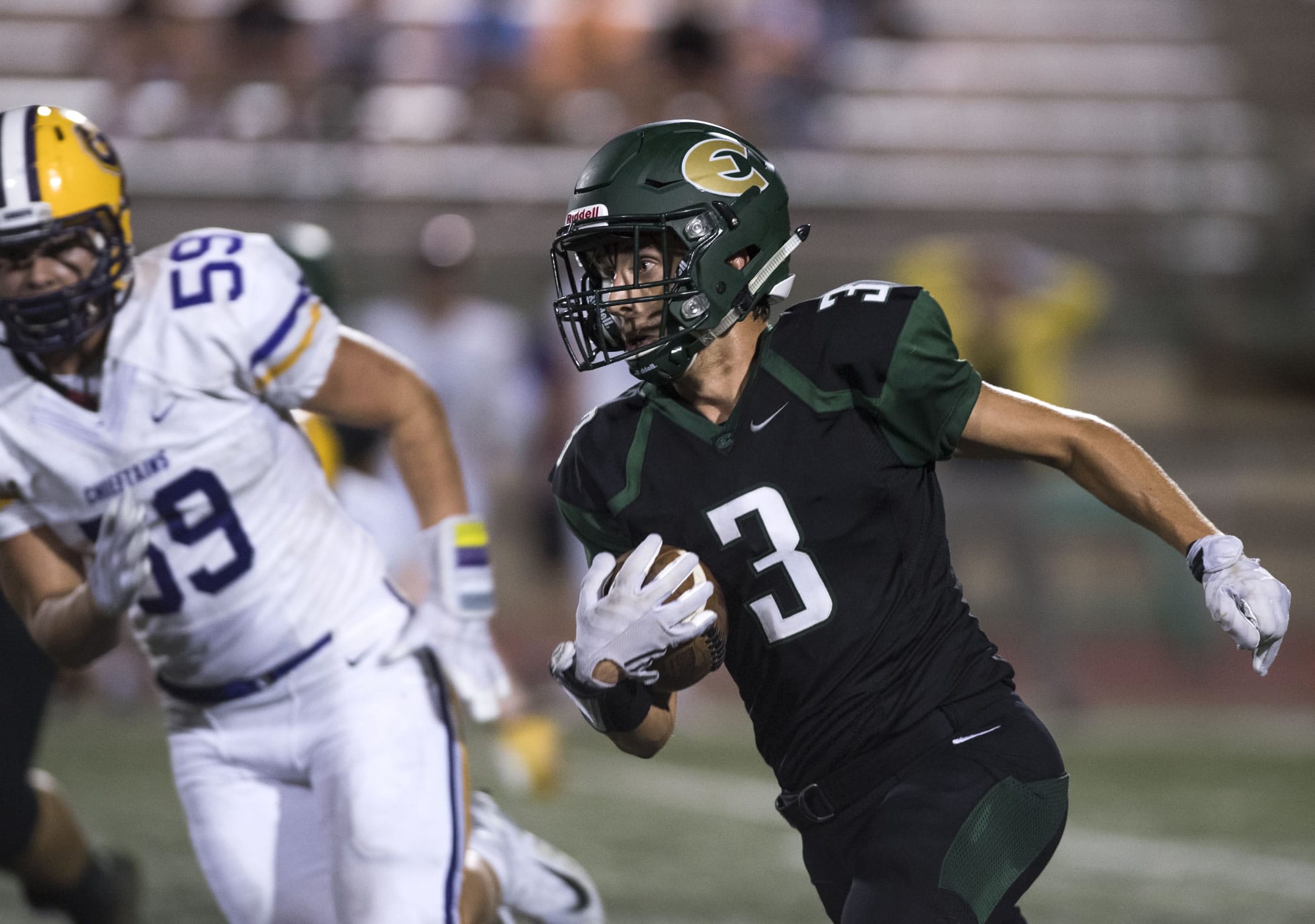 Evergreen's Nadil Hodzic (3) runs the ball during Friday night's game against Columbia River at McKenzie Stadium on Sept. 1, 2017.