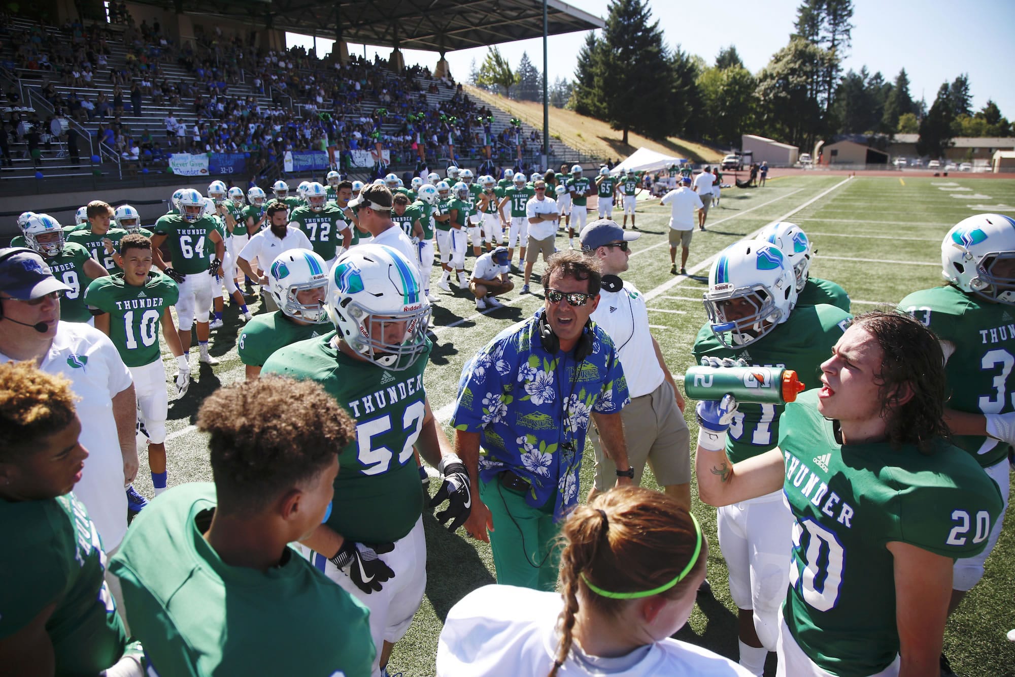 Mountain View head coach Adam Mathieson talks to his team during game vs. Ferris on Saturday afternoon at McKenzie Stadium.