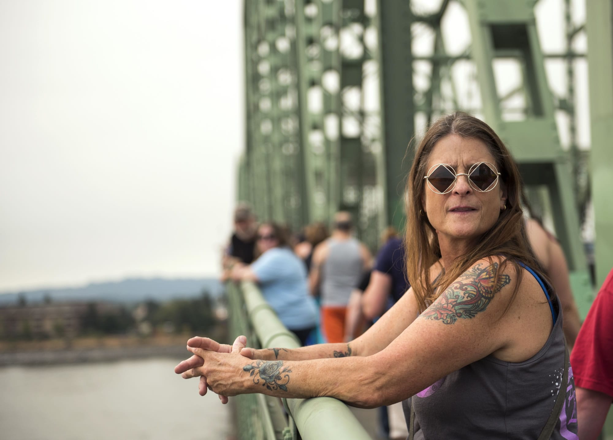 Tamara Lair of Vancouver stands on the Interstate 5 Bridge,  as hundreds of community members join together to celebrate recovery for the 16th annual Hands Across the Bridge event on Monday, September 4, 2017. Lair is celebrating 26 years of sobriety.