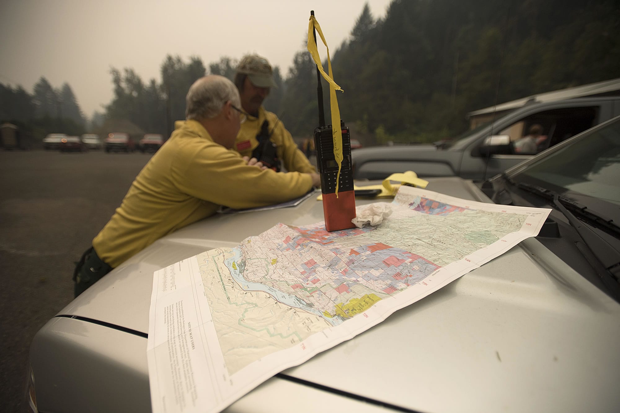 Jim Shank, left, and Colin Robertson of Washington State Department of Natural Resources join efforts to help fight the fire in Skamania on Tuesday afternoon.