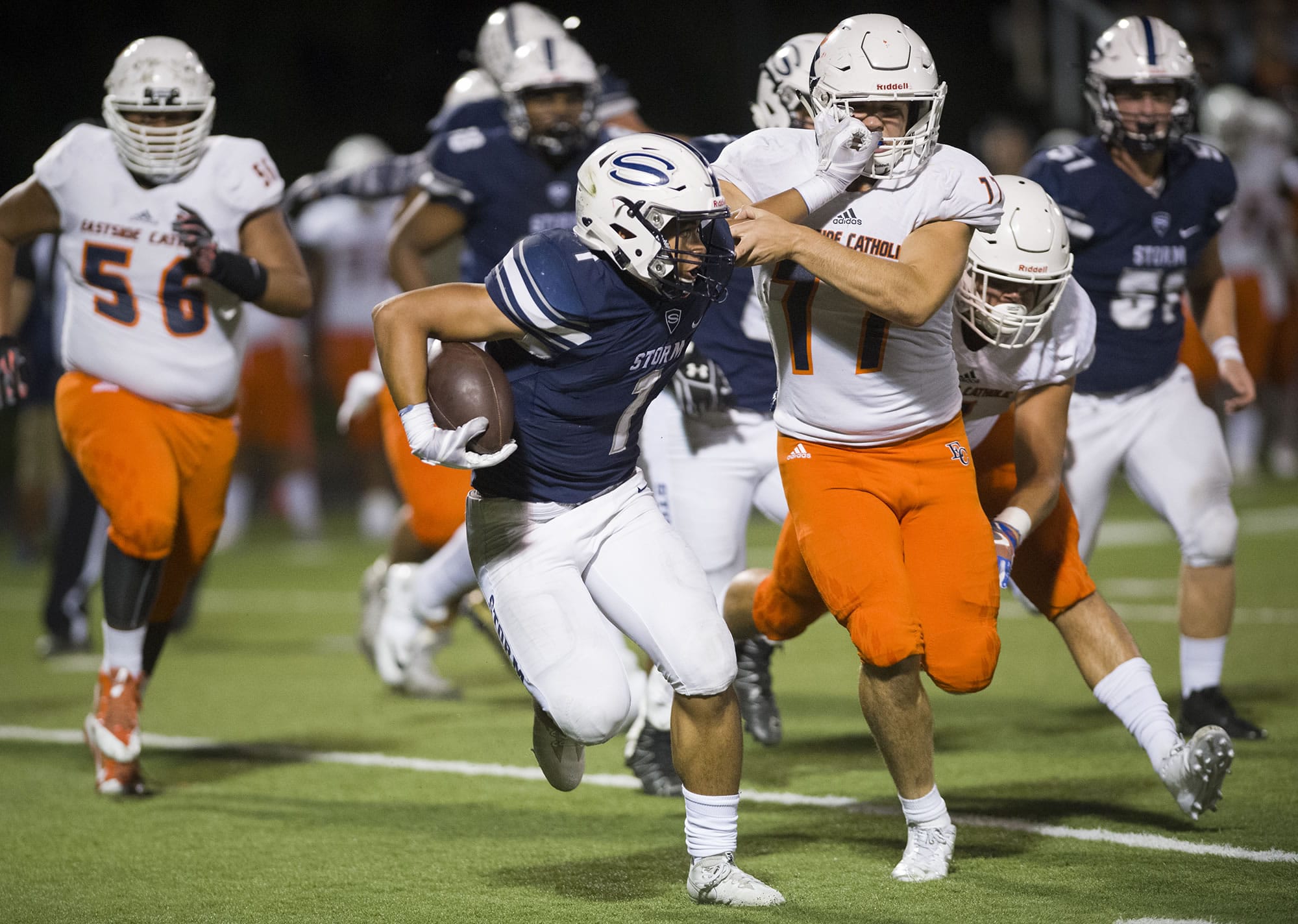 Skyview’s Angelo Sarchi (1) fights off Eastside Catholic’s Ryan Taylor (77) during the first quarter at Kiggins Bowl, Friday evening, September 8, 2017.