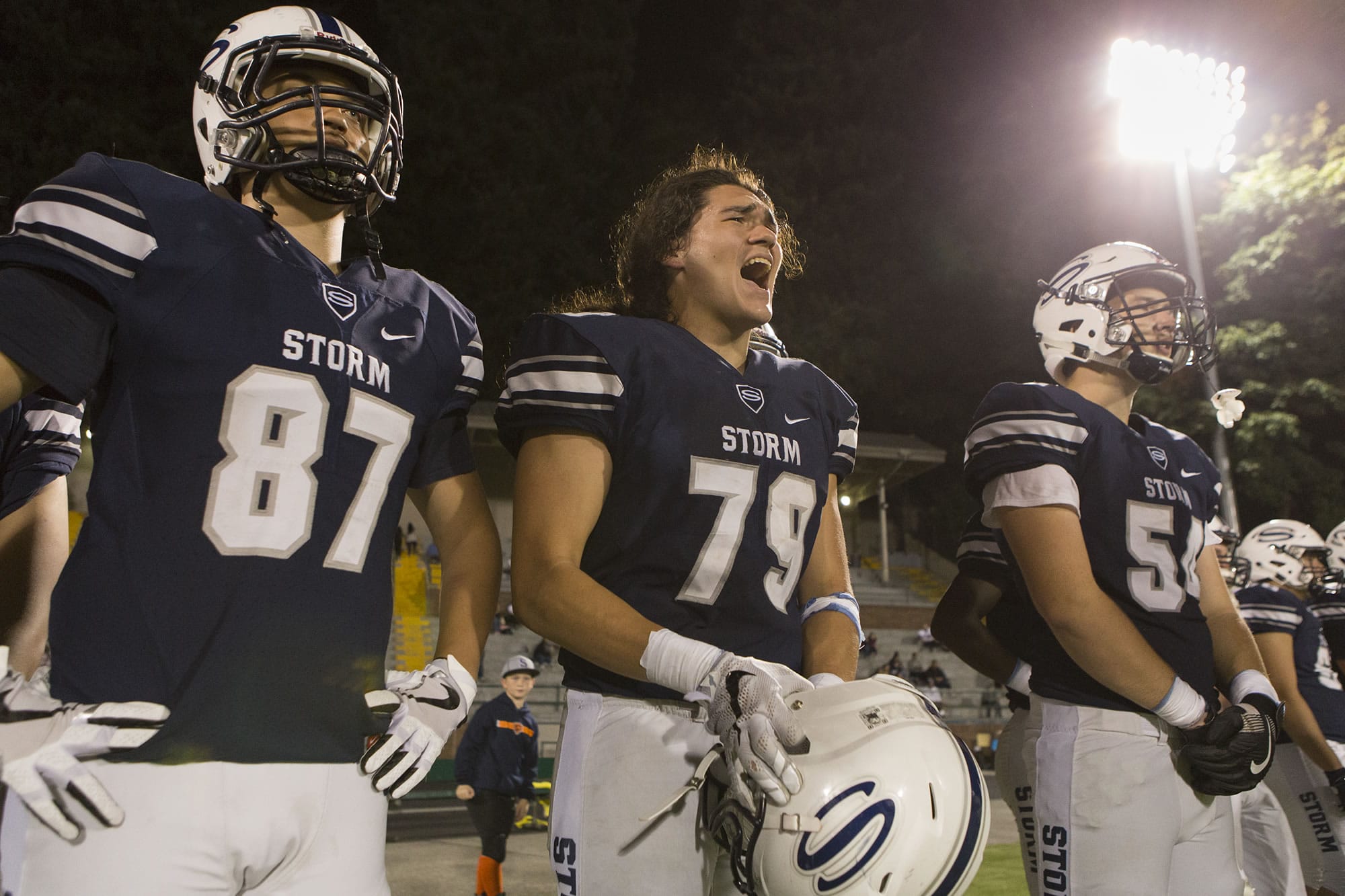 Storm Levi Hoppes (79) amps up his teammates during the Friday night football ball game at Kiggins Bowl between Skyview High School and Eastside Catholic School on Sept. 8, 2017.
