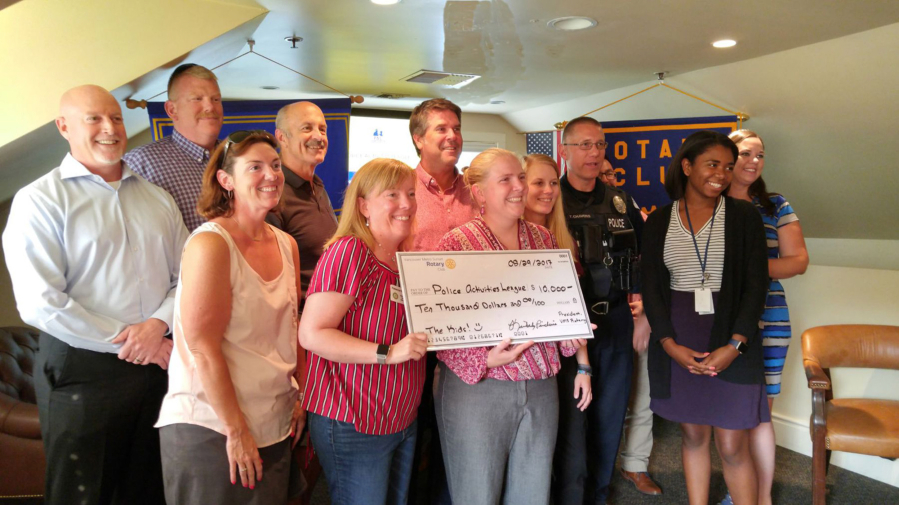 Hudson’s Bay: Members from the Rotary Club of Vancouver Metro Sunset present a check for $10,000 to the Vancouver Police Activities League.