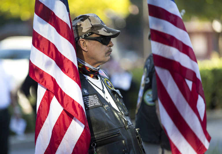 Vietnam veteran Donald Gagnon of Vancouver bears the American flag during the Patriot Day ceremony at Vancouver City Hall on Monday, Sept. 11, 2017. The ceremony was held in honor of those who were affected by the 9/11 terrorist attacks.