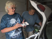Kathy Kolstad shows the belongings she’s kept in her car in case she and her husband have to evacuate their home just west of Archer Mountain. After warnings from their granddaughter and a neighbor on Tuesday morning, Kathy and her husband had help from their granddaughter to packed up important belongings and evacuate.