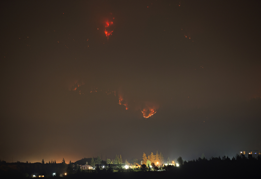 The Eagle Creek Fire continues to burn in the Columbia River Gorge behind Cascade Locks, Ore., as seen on Thursday night from Stevenson.