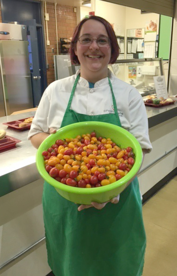 Fircrest: Fircrest Elementary School food service employee Stephanie Hilbert preparing the cherry tomato tasting at the school as part of the Washington State University Extension’s Supplemental Nutrition Assistance Program Education’s Harvest of the Month.