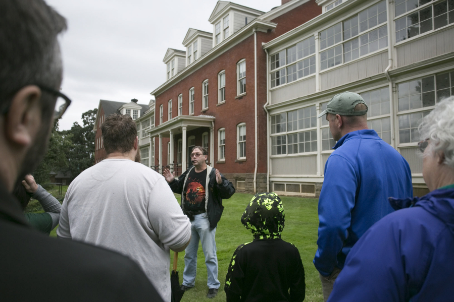 Jeff Davis talks about the history, mundane and otherwise, of the old hospital at the Fort Vancouver National Historic Site during a walking tour Sunday. The tour features ghost stories and history about the fort.