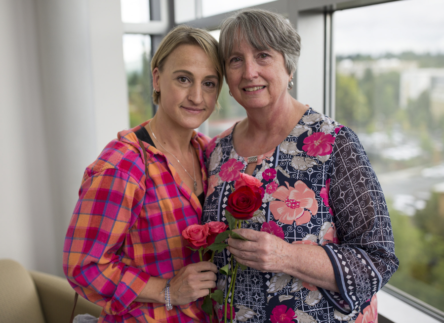 Brenda Eyman, left, and her mother, Linda Phimister, pause Monday after the annual Day of Remembrance ceremony, which honors homicide victims at the Clark County Public Service Center. Phimister’s daughter and Eyman’s sister, Janell Knight, was fatally shot in July 2016 in a triple homicide.