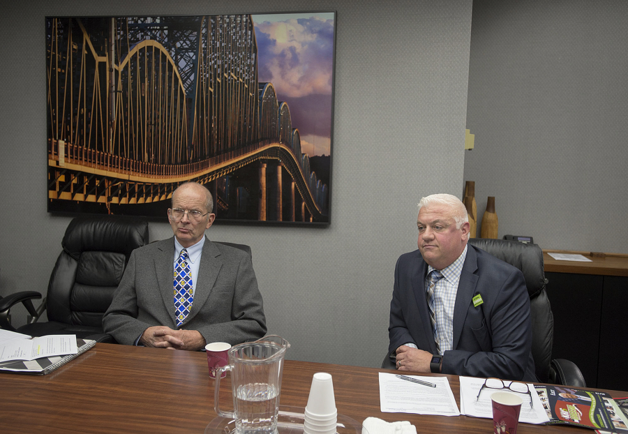 Don Orange, left, and Kris Greene, both candidates for Port of Vancouver commissioner, District 1, take questions from the Editorial Board at The Columbian on Friday morning.