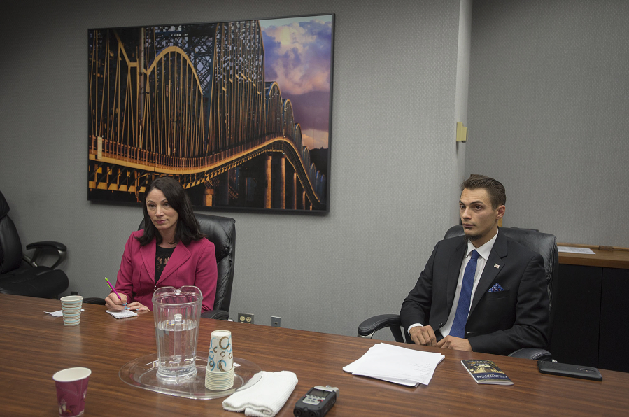 Vancouver City Council candidates Alishia Topper, incumbent, and Justin Forsman speak with members of The Columbian Editorial Board on Friday.