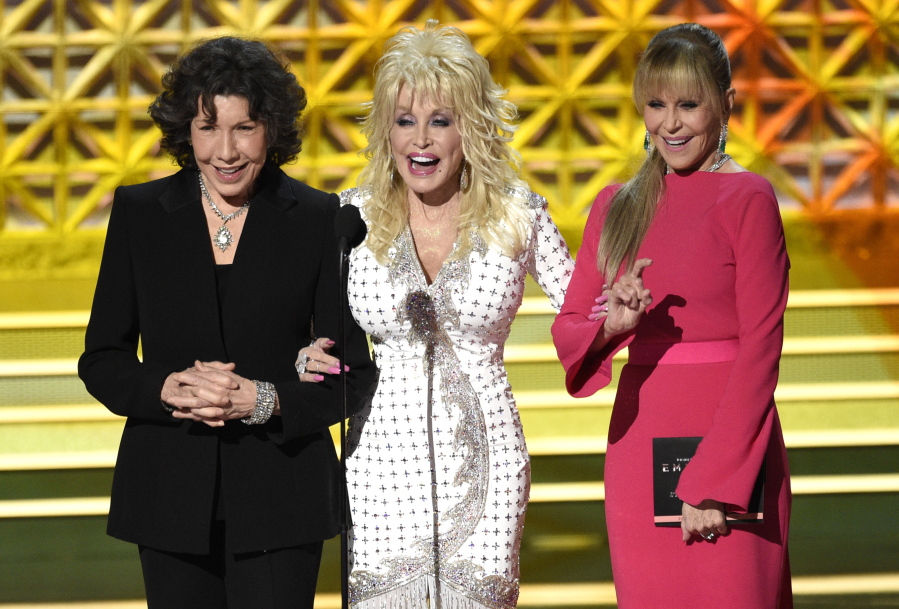 Lily Tomlin, from left, Dolly Parton and Jane Fonda present the award for outstanding supporting actor in a limited series or a movie at the 69th Primetime Emmy Awards on Sunday at the Microsoft Theater in Los Angeles.