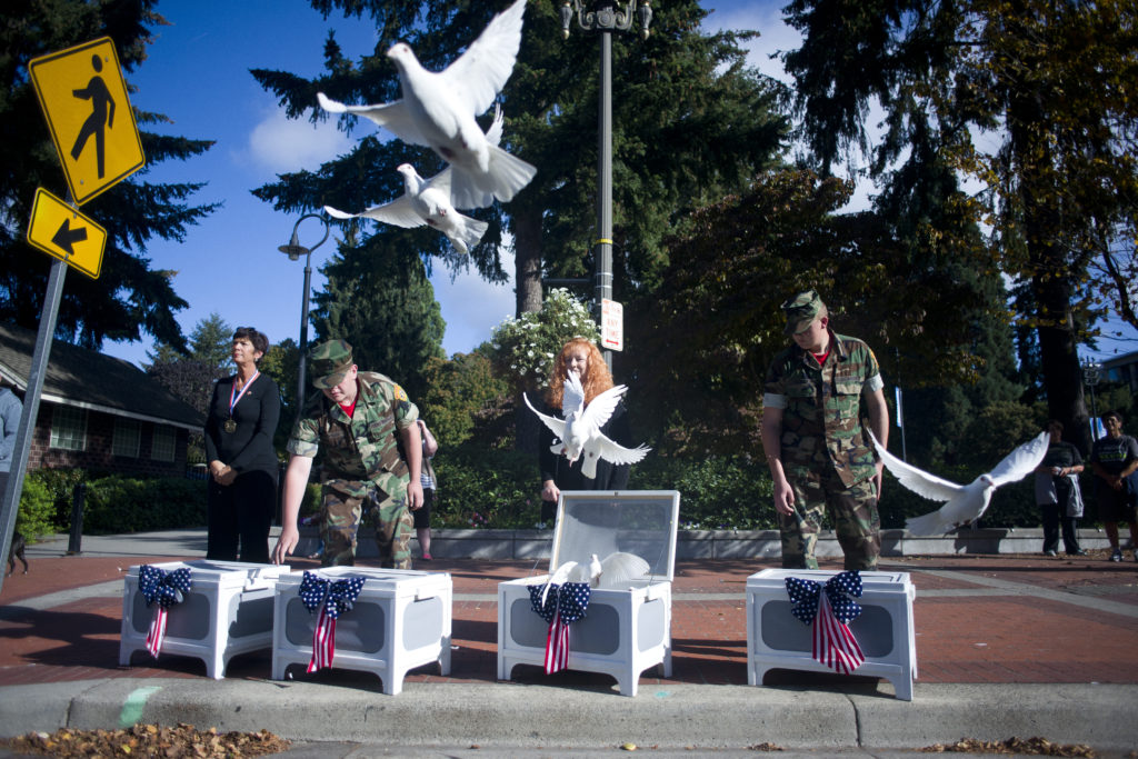 Jadia Ward, second from right, releases doves during the Patriot Day ceremony at Vancouver City Hall on Sept. 11, 2016. The ceremony was held in remembrance of the nearly 3,000 people who died in the terrorist attacks on Sept. 11, 2001.