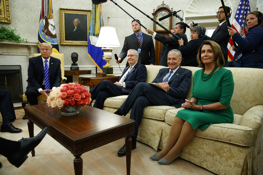 President Donald Trump meets with, from left, Senate Majority Leader Mitch McConnell, R-Ky., Senate Minority Leader Chuck Schumer, D-N.Y., and House Minority Leader Nancy Pelosi, D-Calif., and other Congressional leaders in the Oval Office of the White House, Wednesday, Sept. 6, 2017, in Washington.