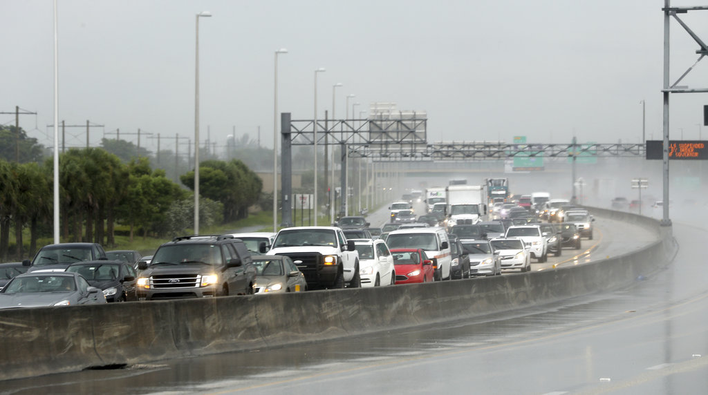 Northbound traffic on the turnpike near Sunrise Blvd. is backed up  in the rain as motorist prepare for Hurricane Irma on Thursday, Sept. 7, 2017 in Sunrise, Fla.  Irma cut a path of devastation across the northern Caribbean, leaving thousands homeless after destroying buildings and uprooting trees on a track Thursday that could lead to a catastrophic strike on Florida.