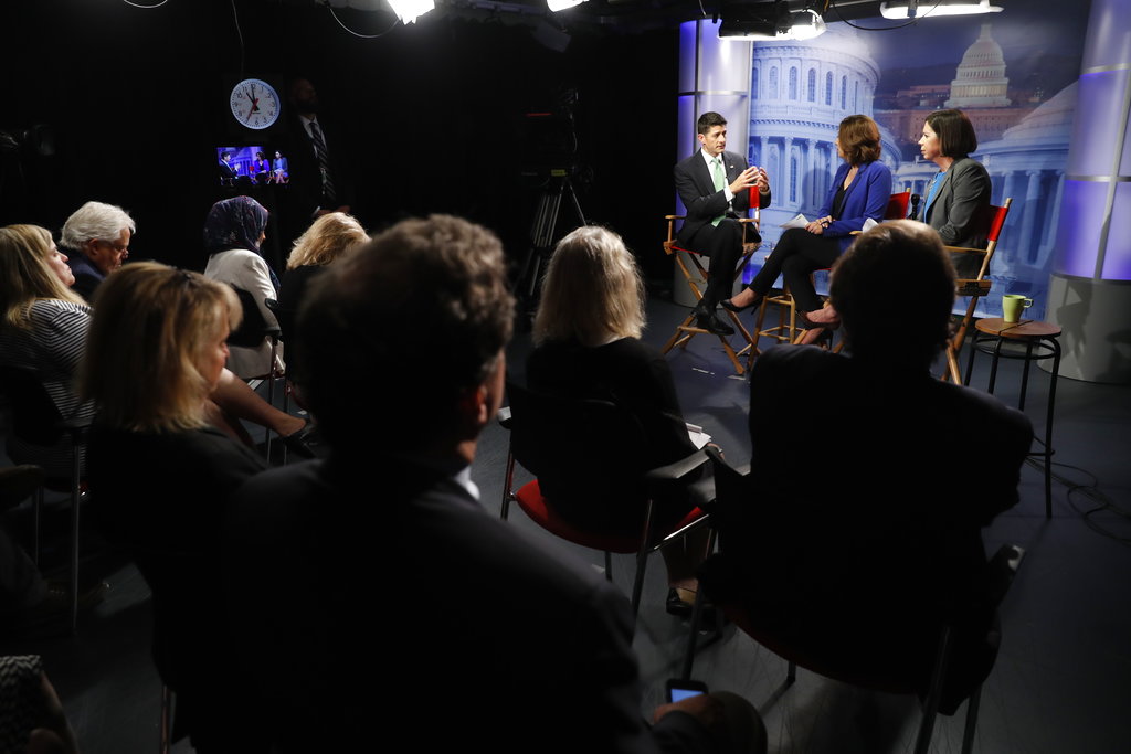 House Speaker Paul Ryan of Wis., left, answers questions during an interview with Julie Pace, AP chief of bureau in Washington; and Erica Werner, AP congressional correspondent, at the Associated Press bureau in Washington, Wednesday, Sept. 13, 2017.