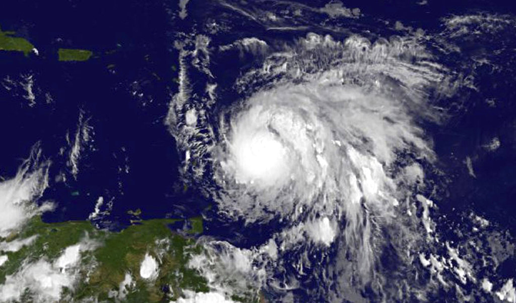 This Sunday, Sept. 17, 2017, GOES East satellite image provided by NASA taken at 7:45 p.m EDT, shows Hurricane Maria as it approaches the Lesser Antilles. Maria swiftly grew into a hurricane Sunday, and forecasters said it was expected to become much stronger over the coming hours following a path that would take it near many of the islands wrecked by Hurricane Irma and then on toward Puerto Rico, the Dominican Republic and Haiti.
