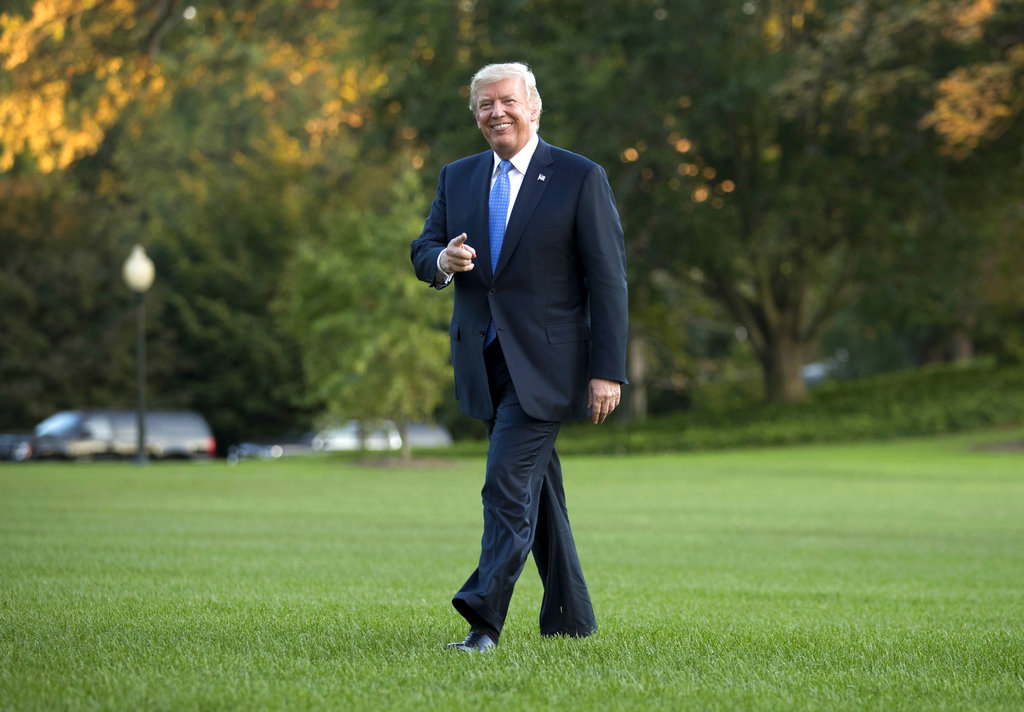 President Donald Trump walks from Marine One across the South Lawn of the White House in Washington, Wednesday, Sept. 27, 2017, as he returns from Indianapolis.